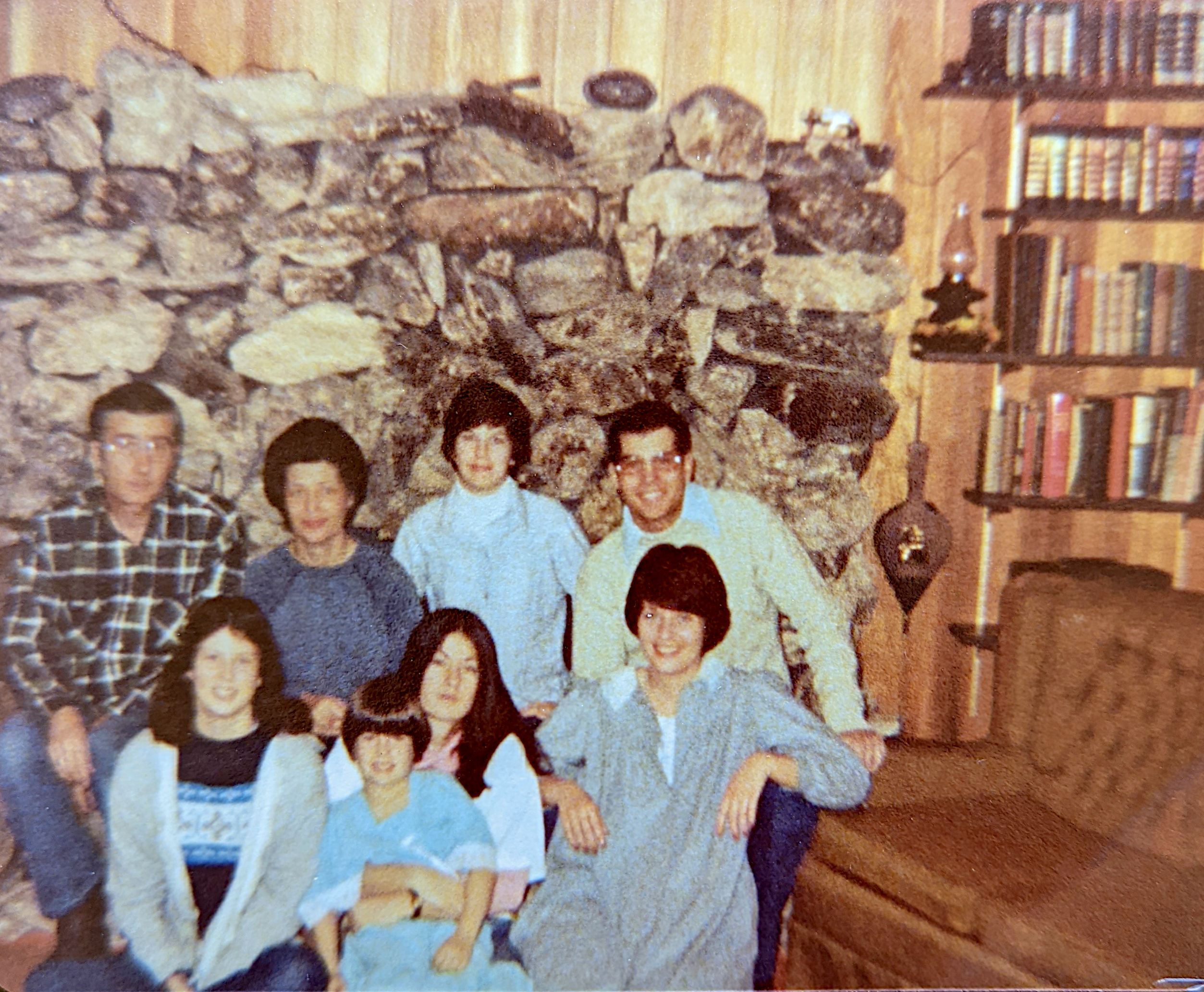 James Bartlett with family by Alpena fireplace